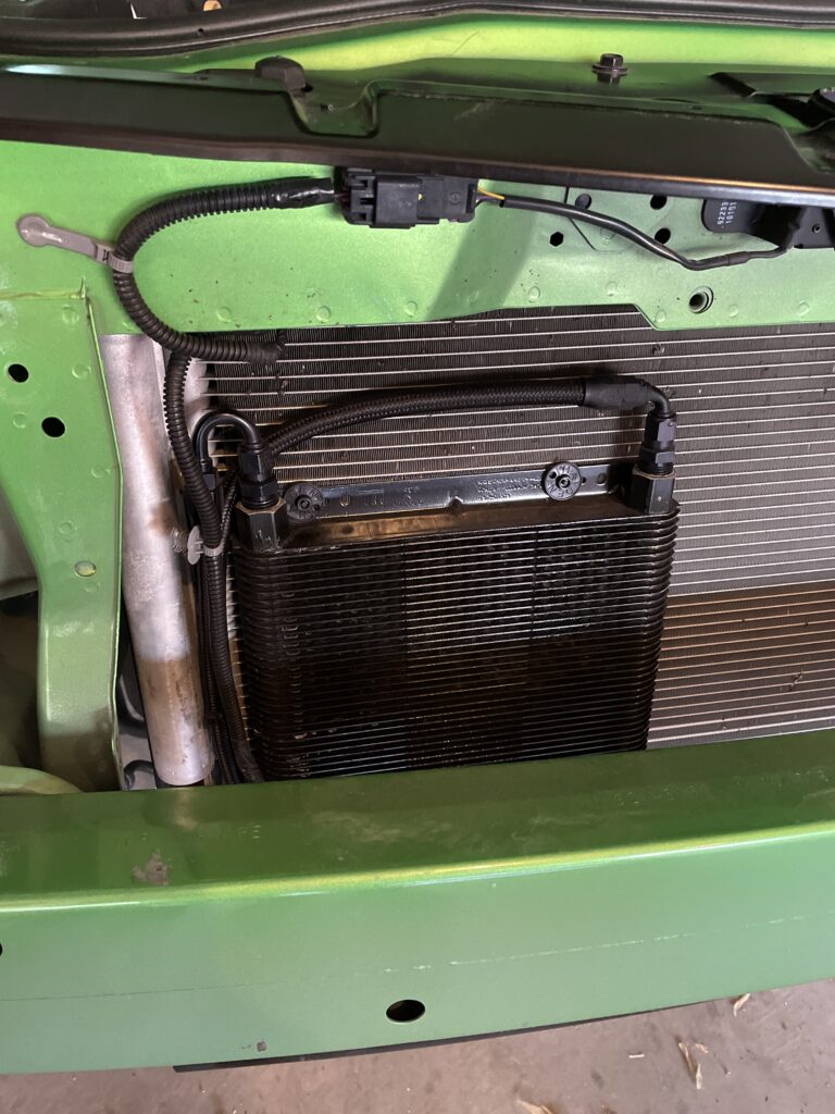 Heat exchanger mounted behind the front bumper of a 2012 Camaro SS