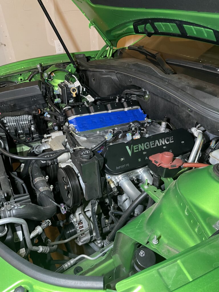 Whipple supercharger and Vengeance Racing valve covers in the Camaro engine bay